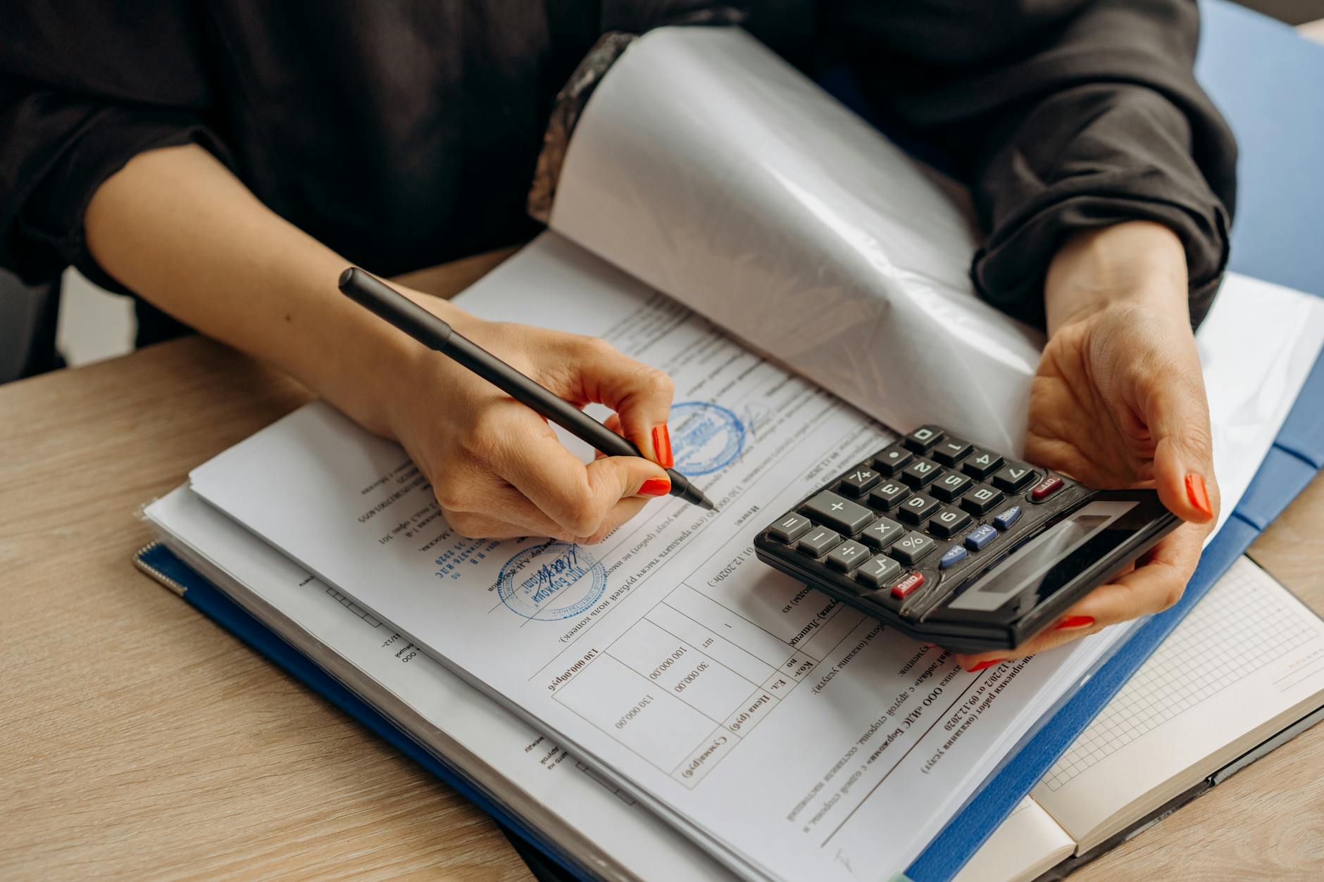 Italian SRL annual accounting and compliance documents on a desk